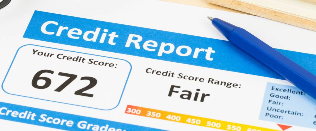 Fair credit score report with pen