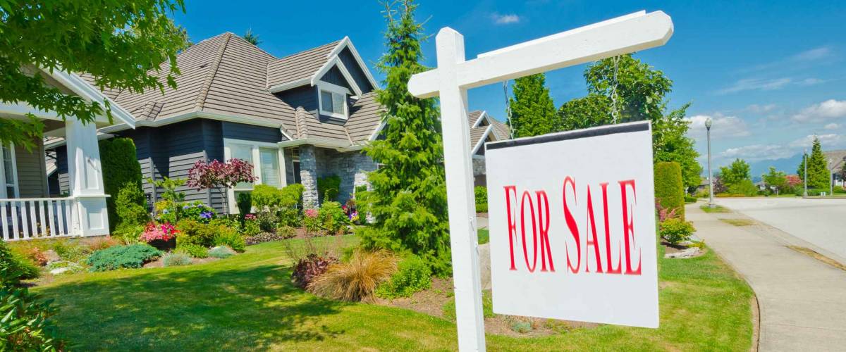 House, sign for sale for big custom made luxury house in the suburbs of Vancouver, Canada.