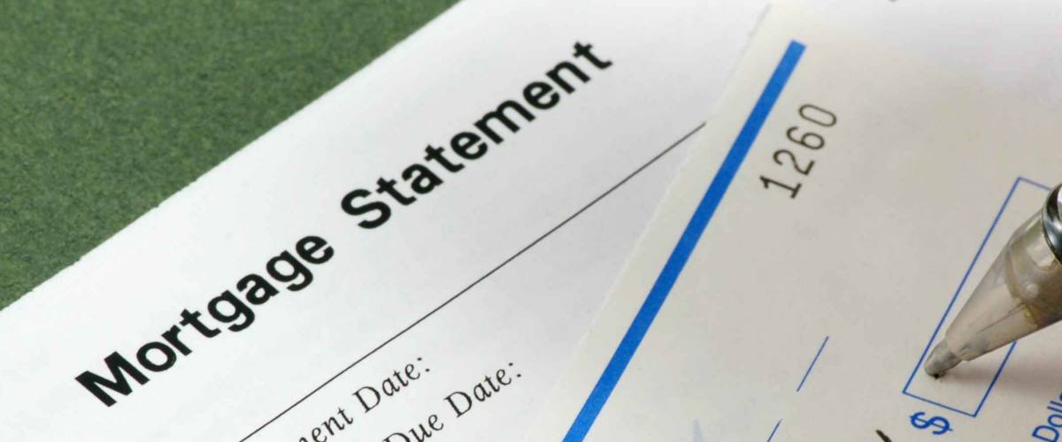 Writing a check for the mortgage payment