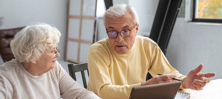 Older couple looking stressed