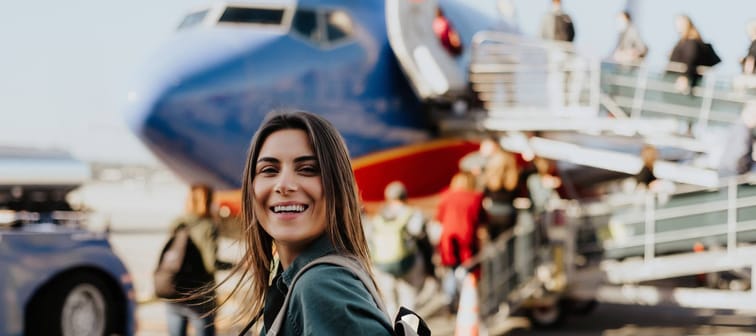 Young woman about to board an airplane