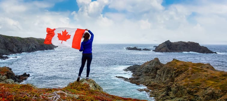 Woman holding Canadian flag