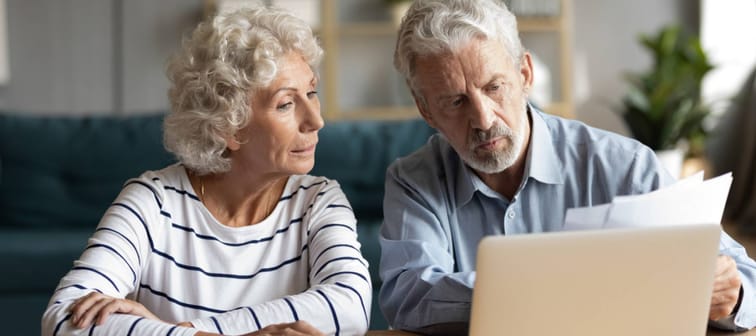 Older couple discussing paperwork