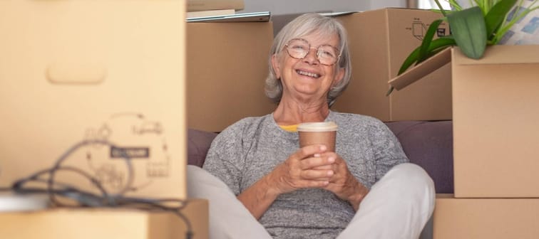 Woman in front of moving boxes
