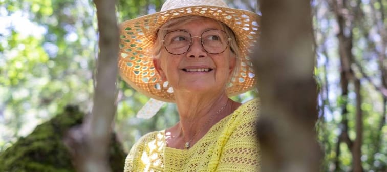 Smiling older woman wearing a sun hat