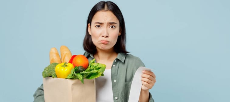 Woman confused with groceries