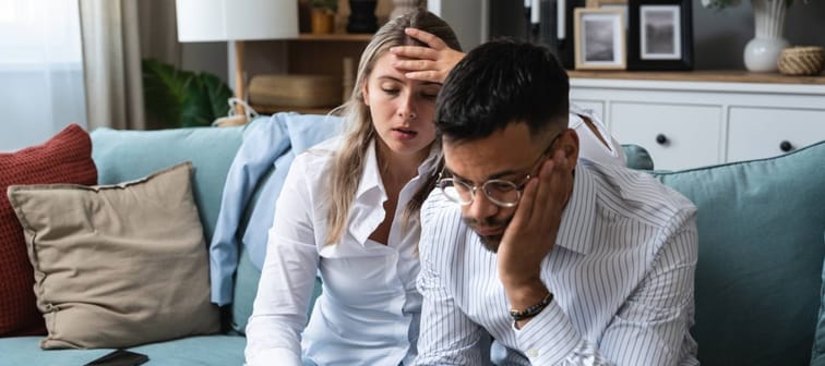 Young couple looking stressed