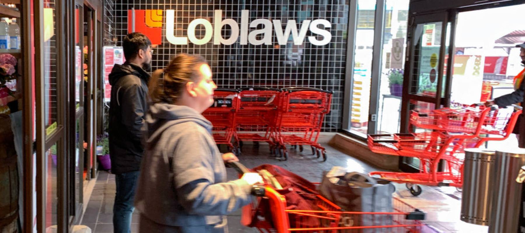 Shoppers are seen at the Loblaws store at Leslie and Lakeshore