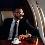 Young wealthy professional on a private jet