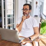 Middle aged man on computer