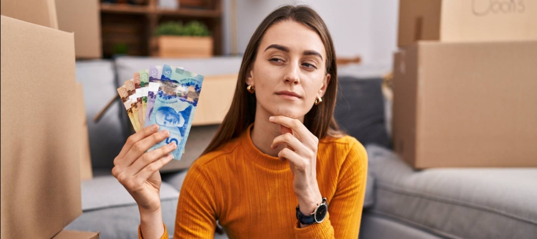 Young woman holding money