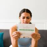 Woman worried about credit card bills.
