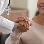 Doctor helping woman