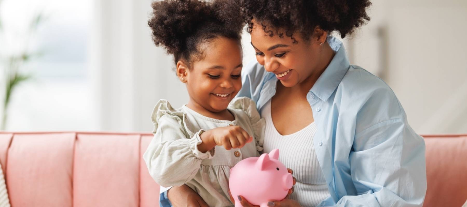 mother and daughter saving money for school
