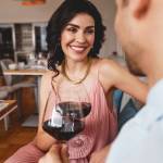 Woman enjoying wine on the couch