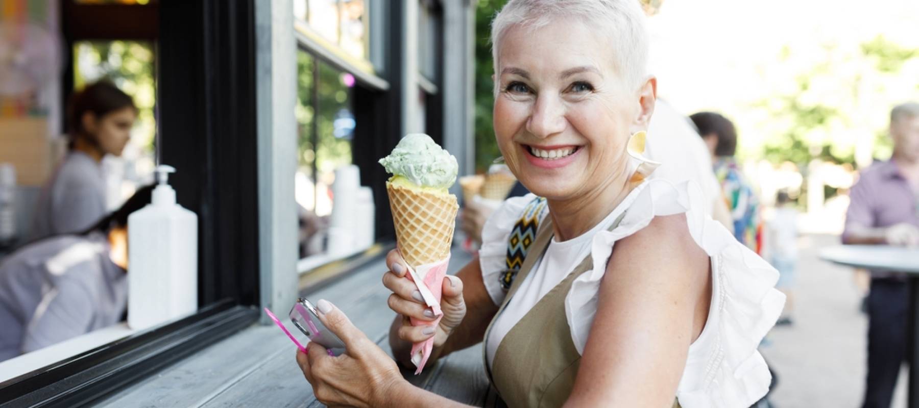 Older woman buying ice cream