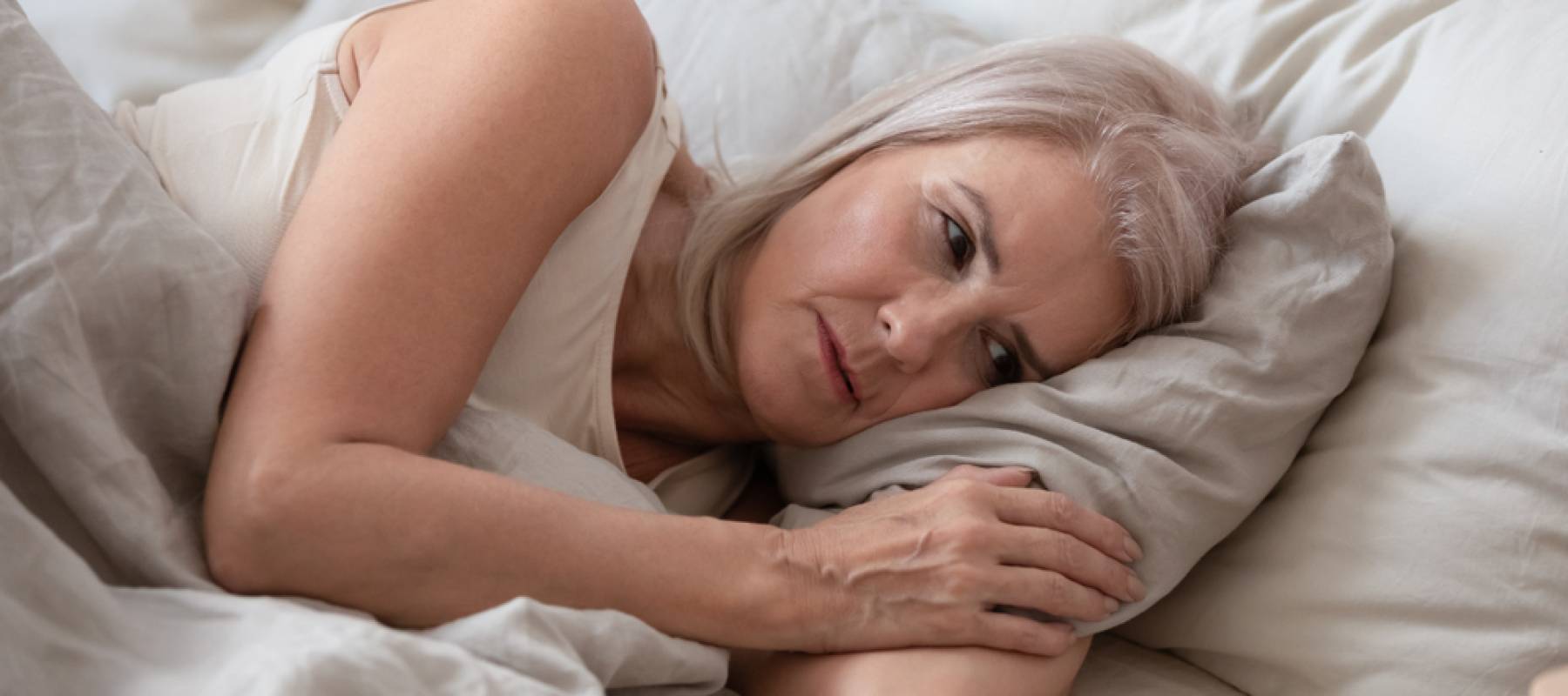 Woman lying in bed