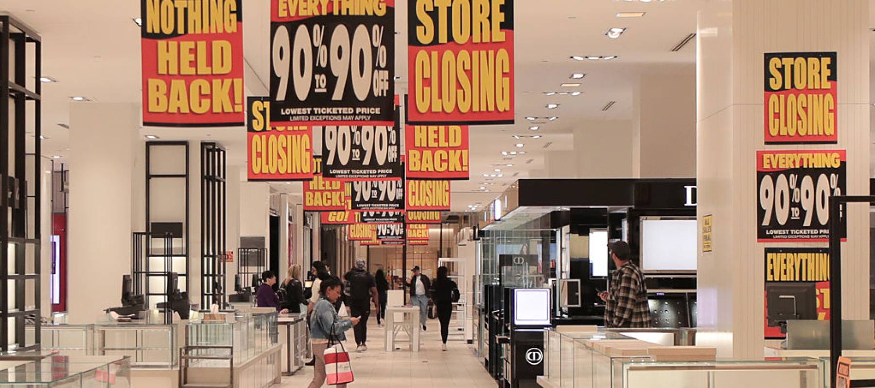 Shoppers make their way through The Hudson's Bay on Queen Street as the 355-year-old department store chain, Hudson's Bay Co., permanently shuts down