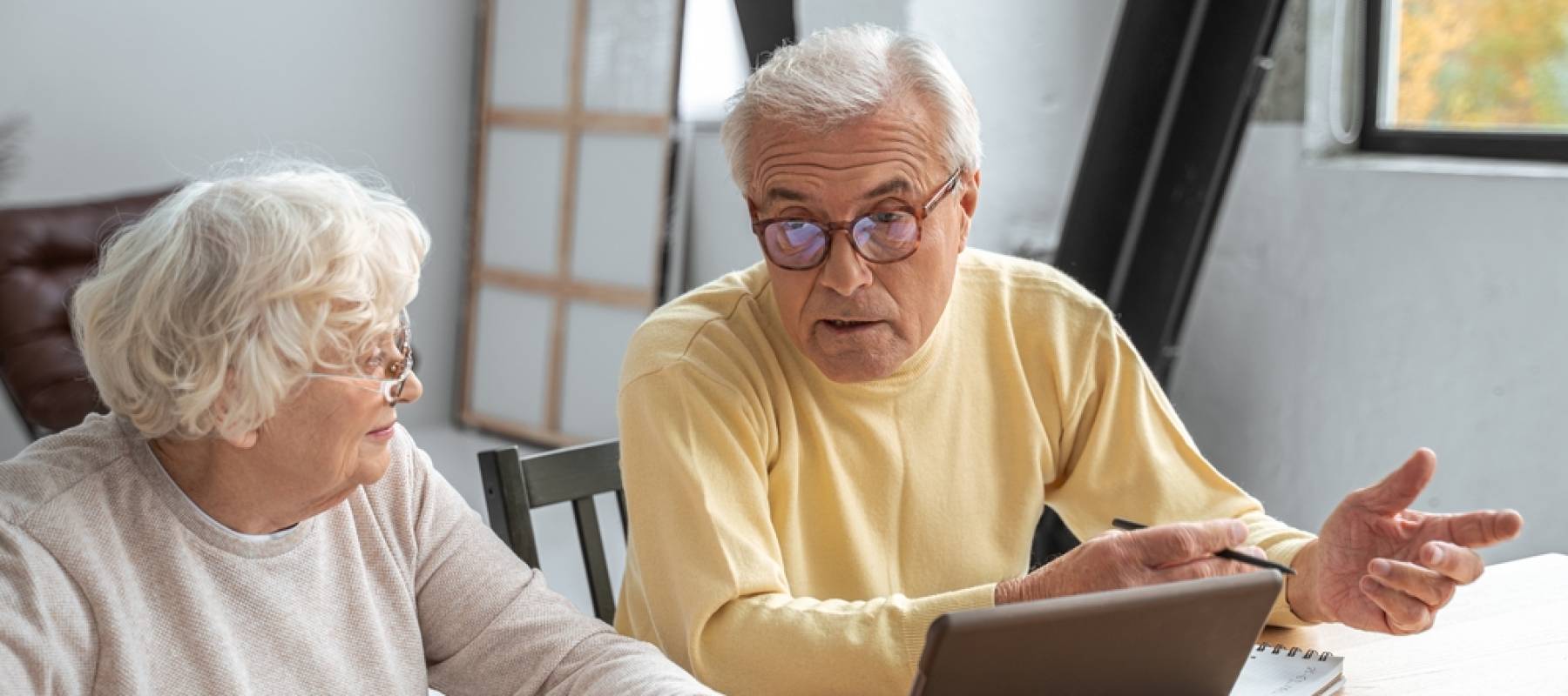Older couple looking stressed