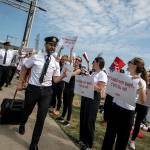 Pilots show their support for Air Canada flight attendants participating in a general strike at Montréal-Pierre Elliott Trudeau International Airport on August 16, 2025