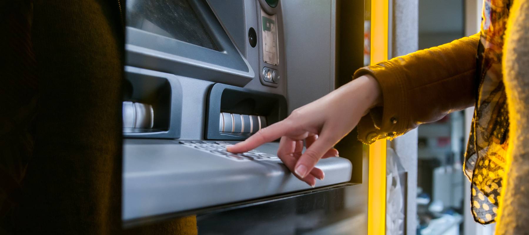Woman using the ATM