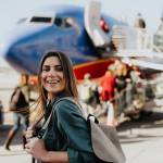 Young woman about to board an airplane
