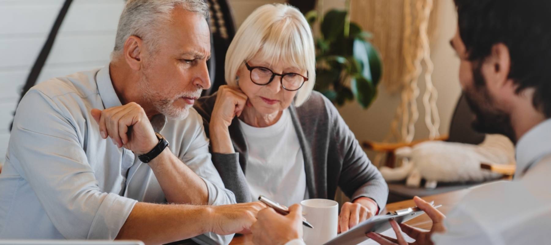 Older clients consulting financial planner.