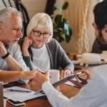 Older clients consulting financial planner.
