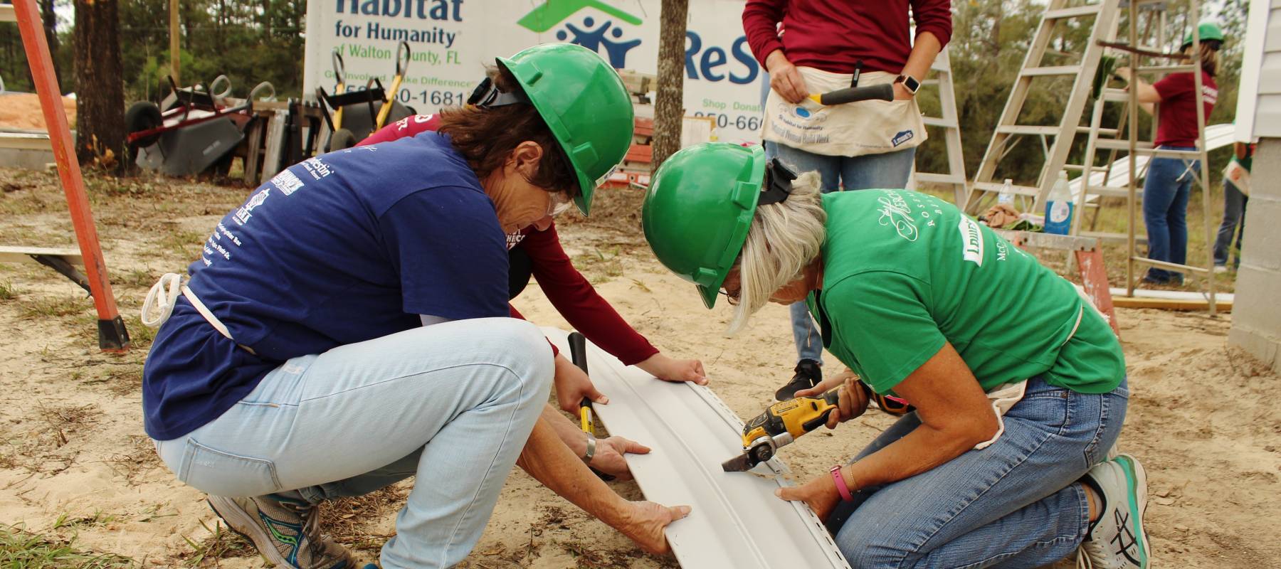 Two women building home