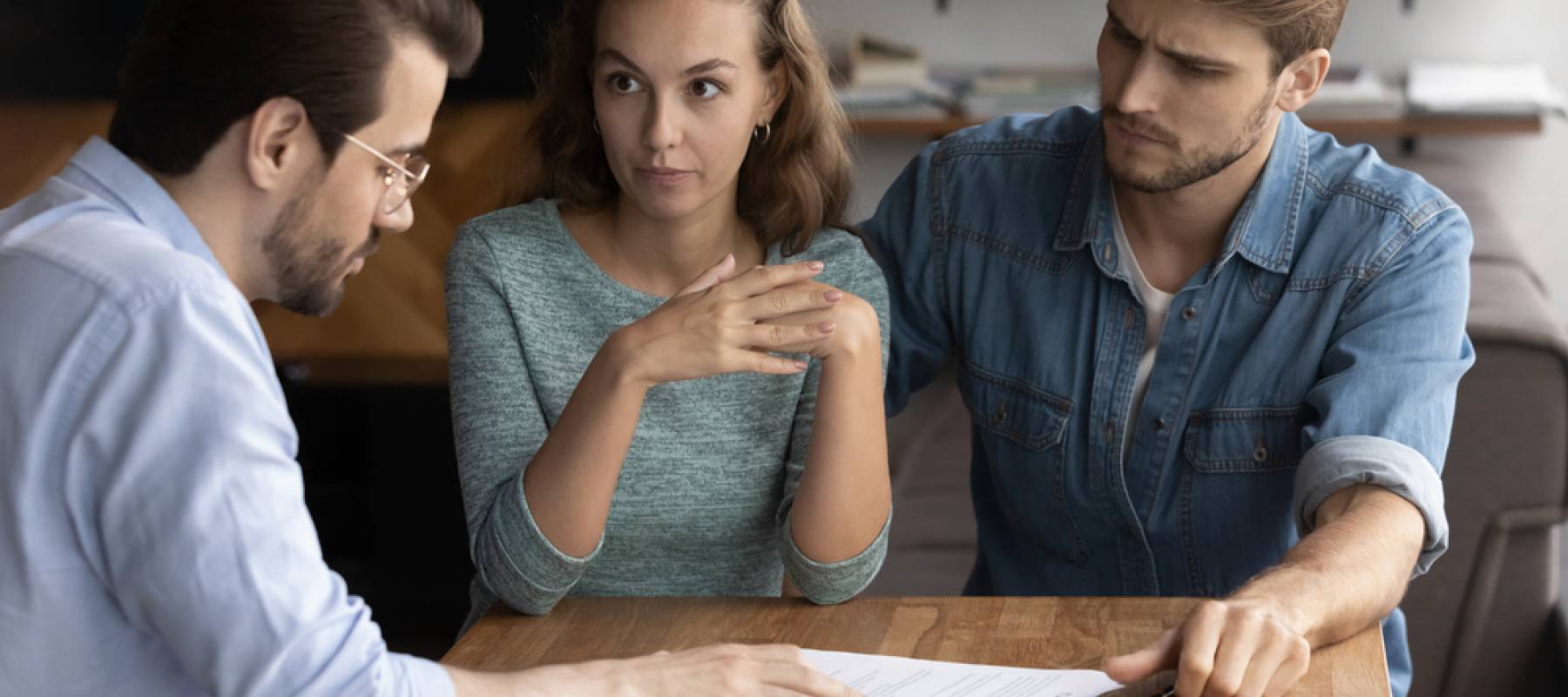 Confused couple talking about their mortgage