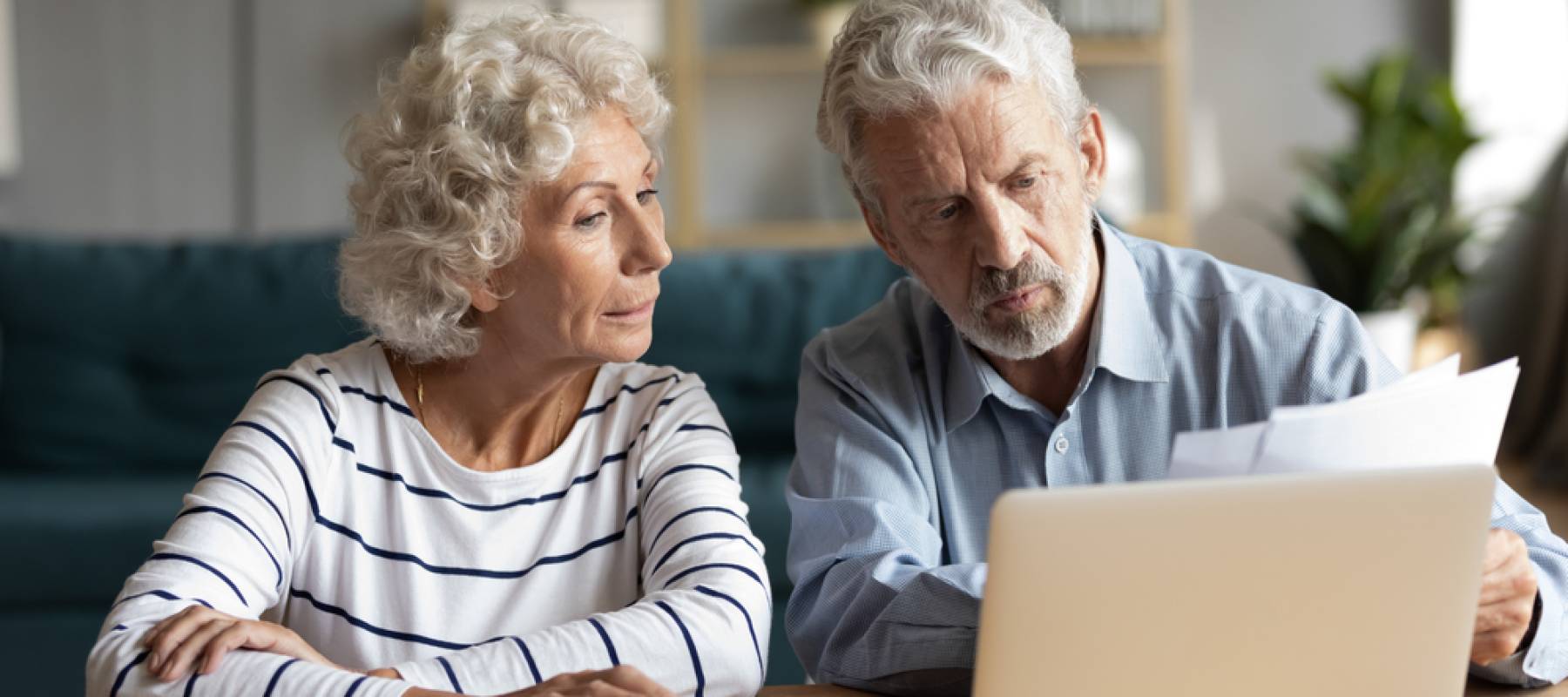 Older couple discussing paperwork