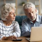 Older couple discussing paperwork