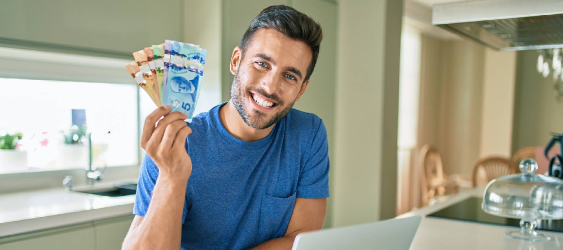 Man holding Canadian bills