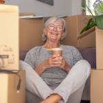 Woman in front of moving boxes