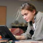 Young woman working on tablet