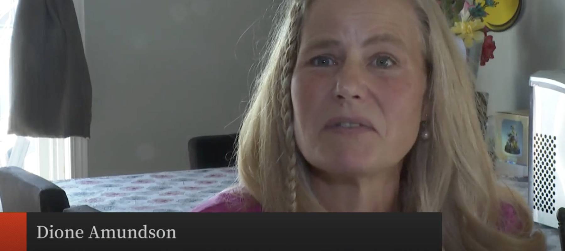 Woman speaking to news about medical debt