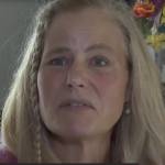 Woman speaking to news about medical debt
