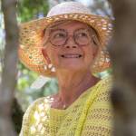 Smiling older woman wearing a sun hat