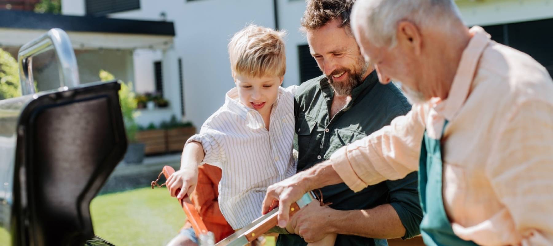 Retired man helping his son and grandson