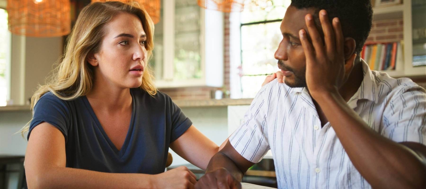 Frustrated couple discussing prenup