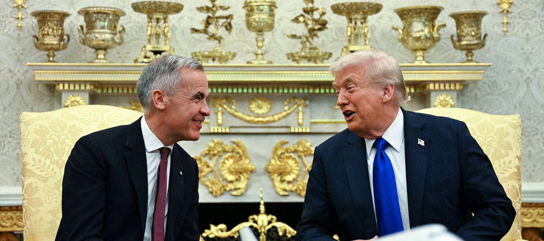 US President Donald Trump meets with Canadian Prime Minister Mark Carney in the Oval Office of the White House in Washington, DC on October 7, 2025