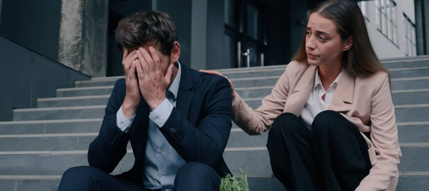 Woman consoling male