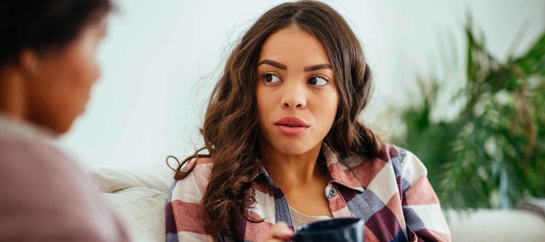 Young woman talking to older woman.