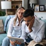 Young couple looking stressed