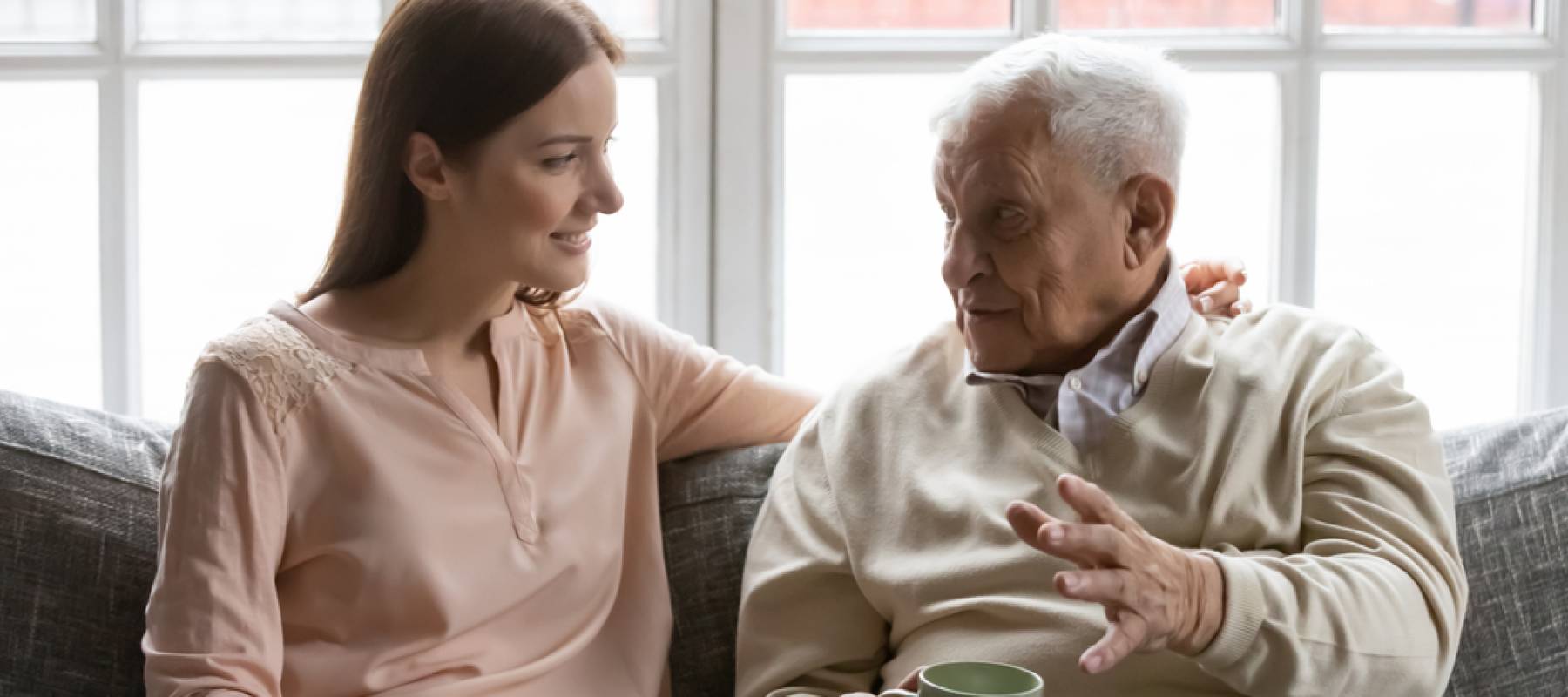 Woman talking to ageing father