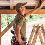 Construction worker building roof