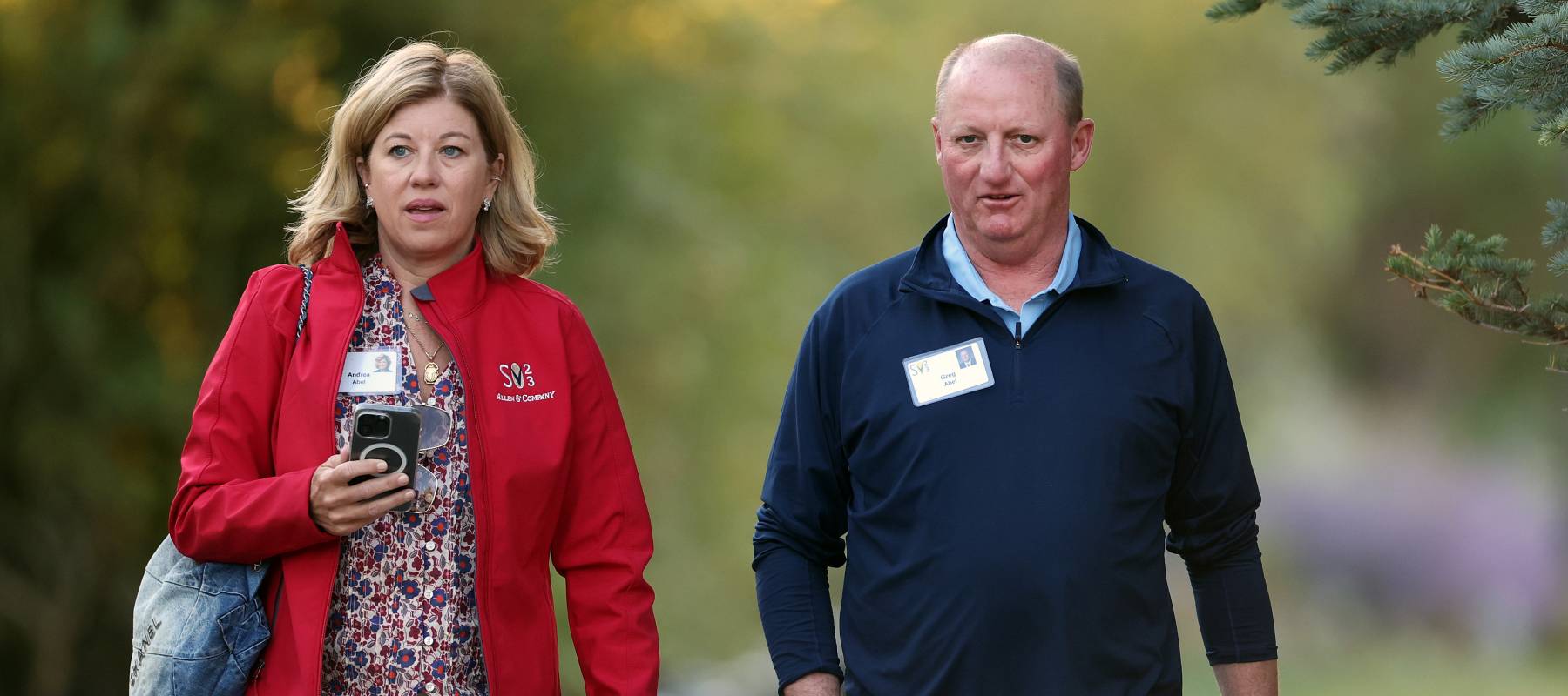Greg Abel, CEO of Berkshire Hathaway Energy, and Andrea Abel walk to a morning session at the Allen & Company Sun Valley Conference on July 14, 2023