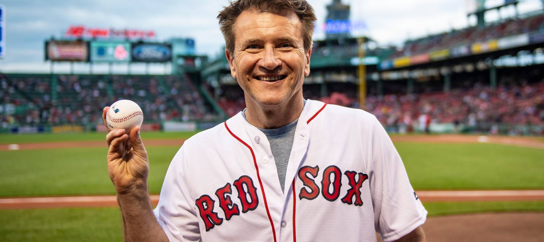 Robert Herjavec of Shark Tank poses for a photograph after throwing out a ceremonial first pitch in 2018