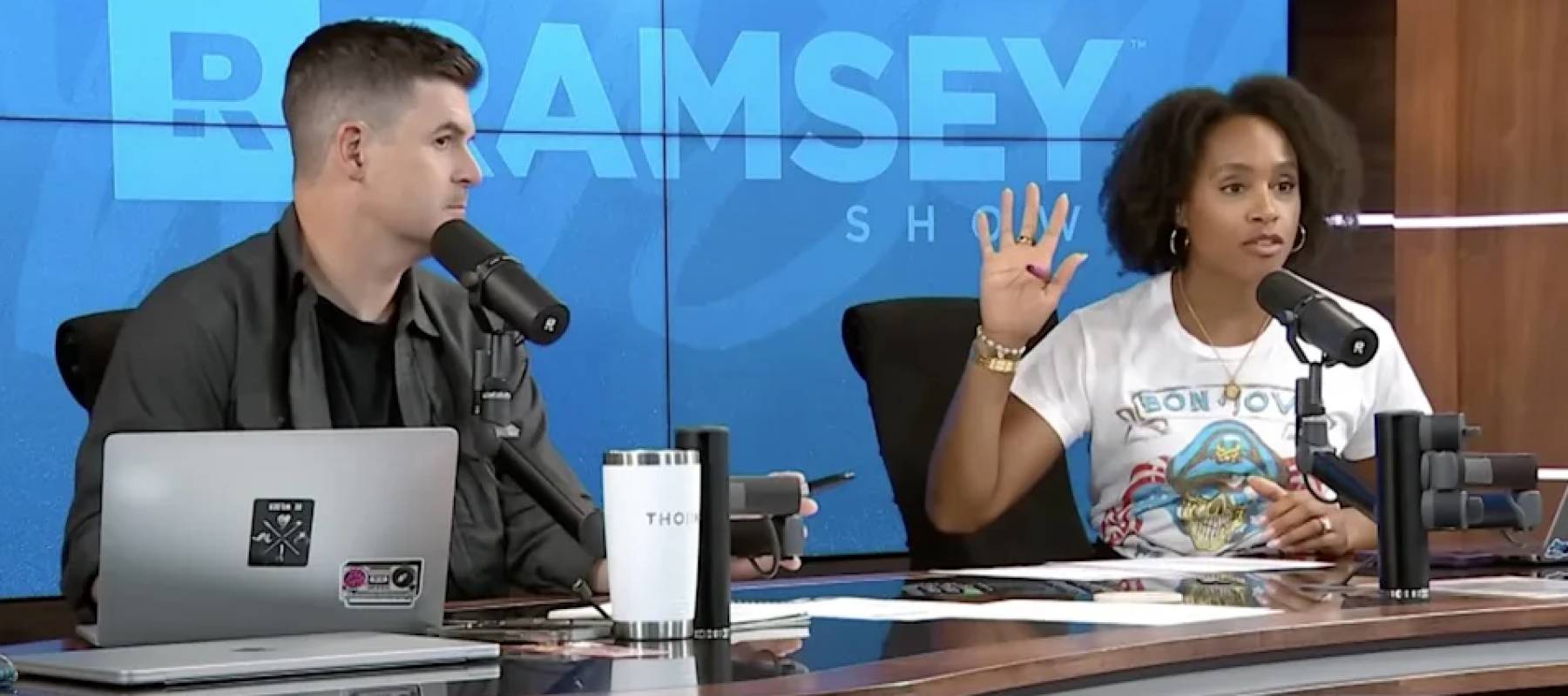 Ramsey Show hosts taking a call