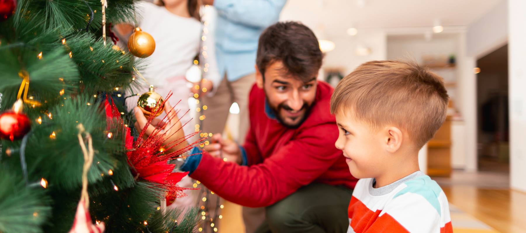 Beautiful happy multi-generation family gathered at home for winter holiday season celebration